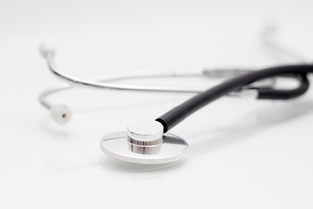 Medical stethoscope on glass white table.の写真素材