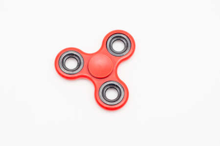Fidget spinner toy isolated on white backgroundの写真素材