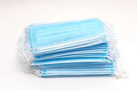 Stack of new medical masks. Disposable face masks. Prevent coronavirus pandemic 2019-ncov.