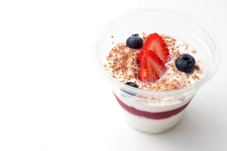 Dessert cottage cheese mousse with strawberries, granola, blueberriesの写真素材