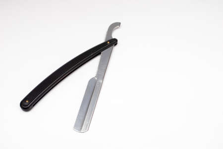 Black straight razor on a white background.の写真素材