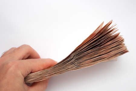 A large wad of money in handの写真素材