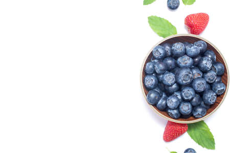 Blueberry on the plate on white background. Top view. Isolated.