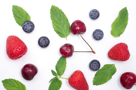 Background of mix berries with free space. Blueberries, strawberries and cherry.の写真素材