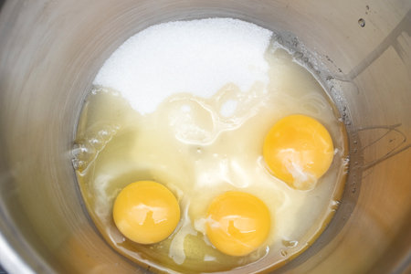 Yolks in a stainless steel bowlの写真素材
