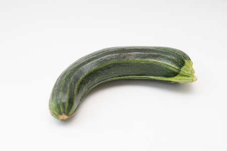 Green crooked squash on a white backgroundの写真素材