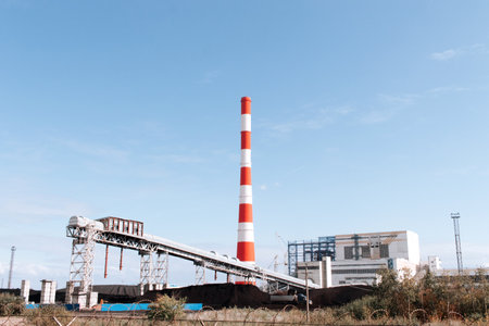 Coal-fired thermal power plant with smoke from pipesの写真素材