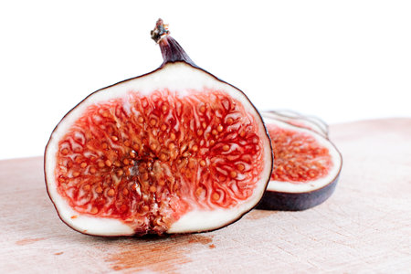 Fresh cut sliced figs on board