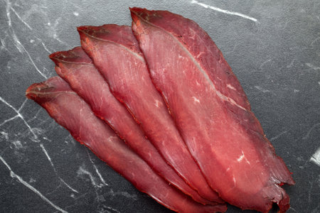 Roasted beef, pastrami on black board.の写真素材