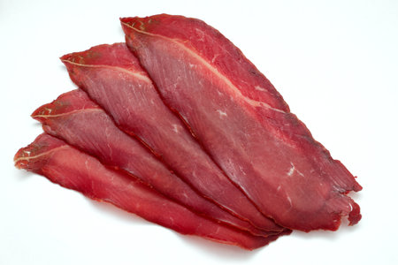 Sliced Pastrami meat isolated on white background.の写真素材