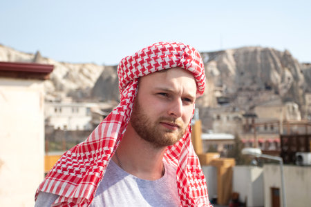 Arabian man wearing keffiyeh in the arabic cityの写真素材