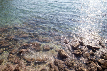 Sea and stone beach. top view bayの写真素材
