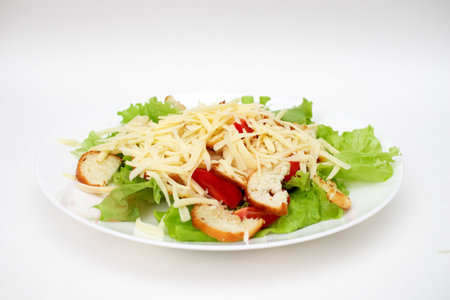 Caesar salad in a plate on a white backgroundの写真素材