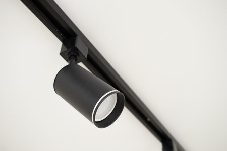 Black track spot Light on white stretch ceilingの写真素材