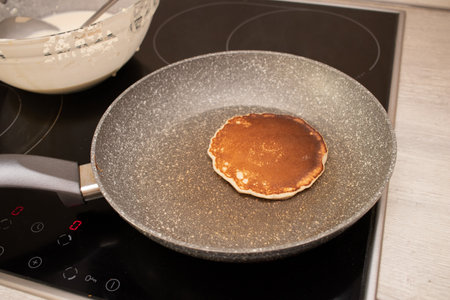 Making pancakes on frying pan. Step by step recipe for making pancakes. Step 5の写真素材