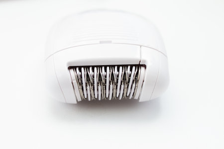 Electric epilator for hair removal on a white background