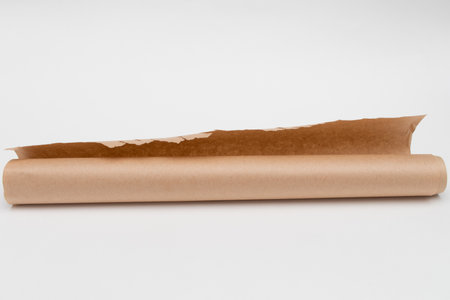 Roll of baking parchment paper on white backgroundの写真素材