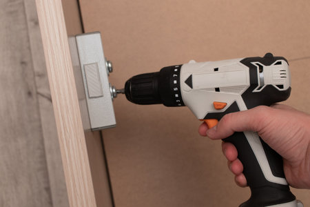 Assembling a new bed using a screwdriver