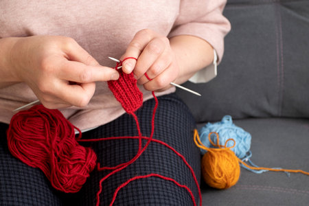 Woman hands knitting at home.の写真素材