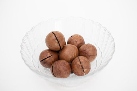 Glass bowl with Macadamia nuts.の写真素材