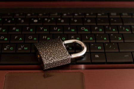 Metal padlock laptop keyboard. fraud protection.の写真素材