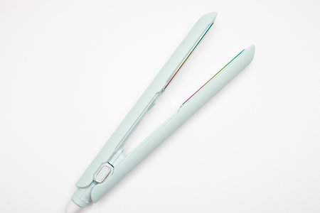 hair iron with ceramic plates on white.