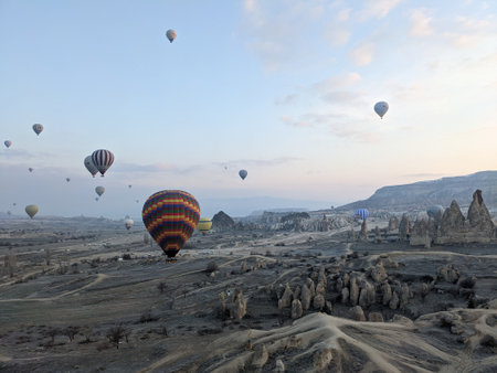 Hot air balloons flying above Cappadocia valley Anatolia, Turkey at sunriseの写真素材