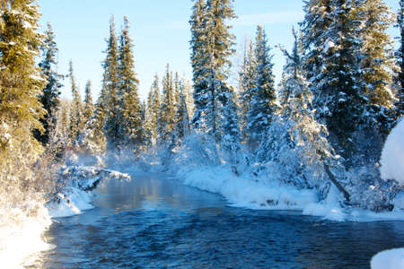 Beautiful winter sunset on the river Lena in Russiaの写真素材