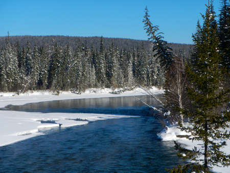 Beautiful winter sunset on the river Lena in Russiaの写真素材