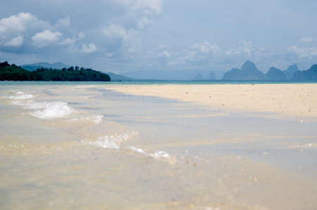 The quiet waves go in coral sands beach at Phang Nga Bay near Krabi and Phuketの写真素材