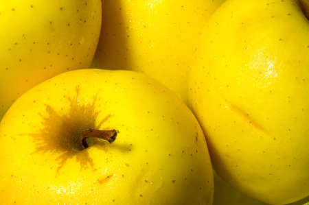 Yellow Golden Delicious apples closeup.