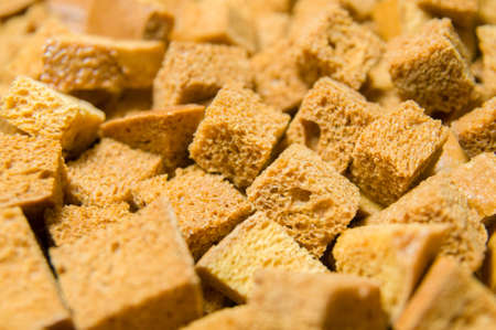 White bread high-fired croutons close-up focus at the centre.の写真素材