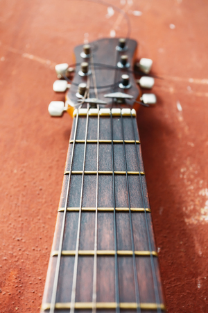 brown guitar on a old brown background