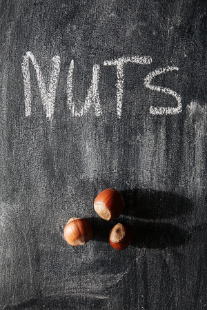 nuts on the background of the blackboardの写真素材