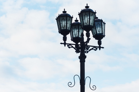 Beautiful old lamp post against a blue sky