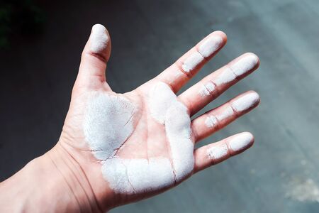 The man\'s hand, a visible imprint, white wristの写真素材