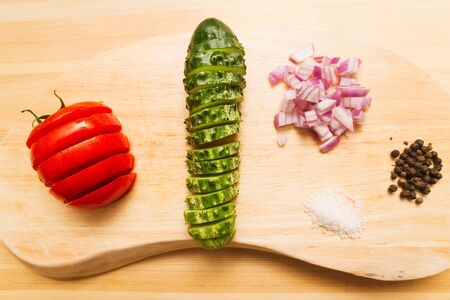Fresh ingredients for a salad, cutting boardの写真素材