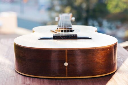 Guitar against the background of the cityscapeの写真素材