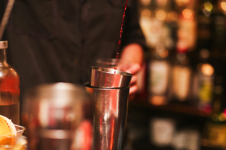 Barman stir alcohol. process of preparing a cocktailの写真素材