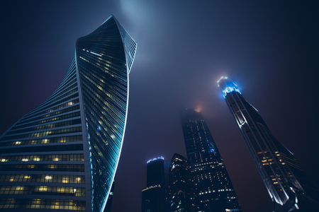 Modern skyscrapers in the center of the city at nightの写真素材