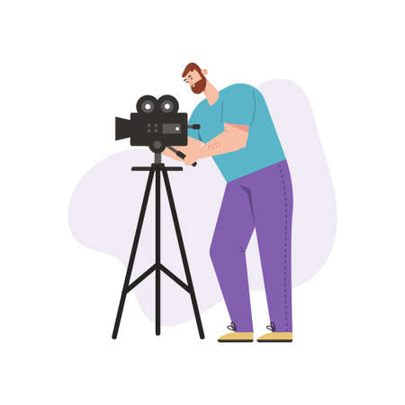 Videographer shoots film on professional camera isolated