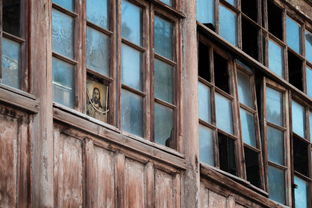 Face of Christ looks out of the broken windows.の写真素材