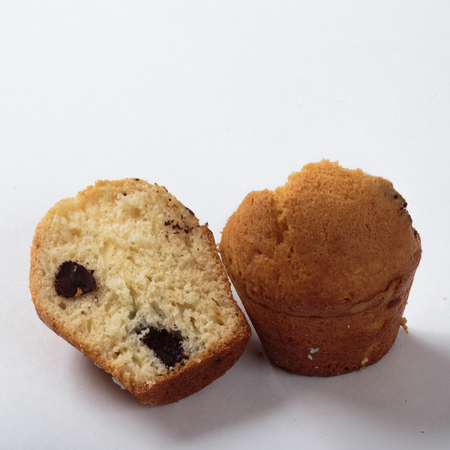 Cupcake with raisins homework on a white background in a cut.の写真素材