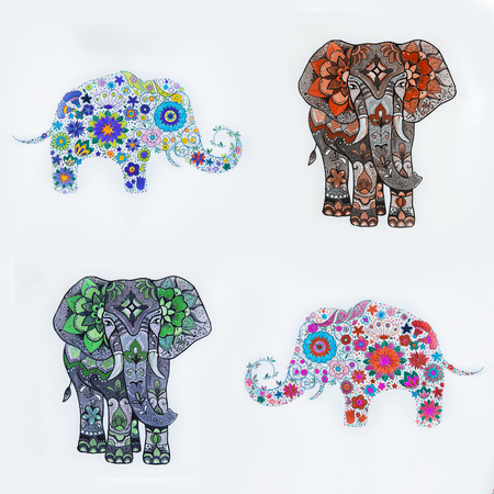 Set of elephant sketches with floral patterns on a white background.の写真素材