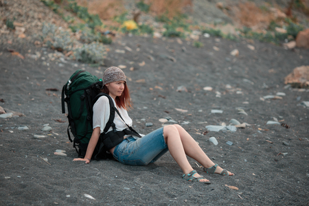 The girl travels to beautiful places on the coast of the sea.の写真素材