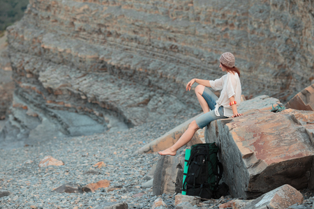 The girl travels to beautiful places on the coast of the sea.の写真素材