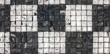 Natural granite stone paving - black and white pavement in a checkerboard pattern. seamless textureの写真素材