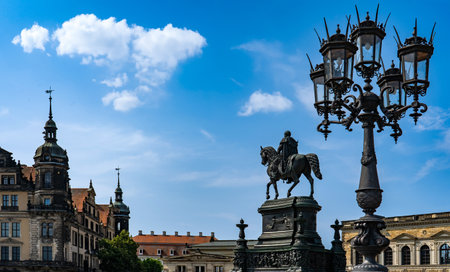 Square in Dresden with Statue of King Konig Johann and beautiful baroque street lightの写真素材