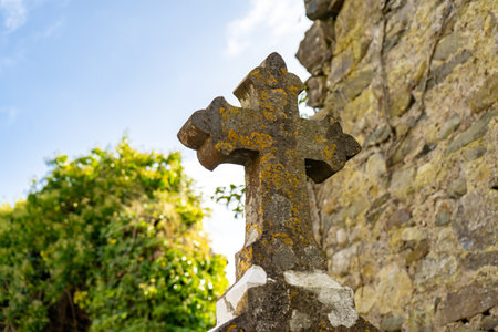 Old Irish cemetery graveyard with church ruins and traditional Celtic cross - Balbriggan, Fingal countyの写真素材