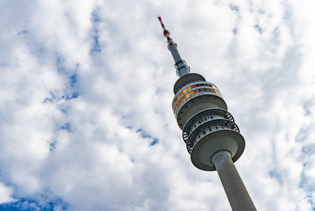 Olympic Tower or Olympiaturm, Munich, Germany. Tension roof on blue sky background. This place is tourist attraction of Munich cityの写真素材